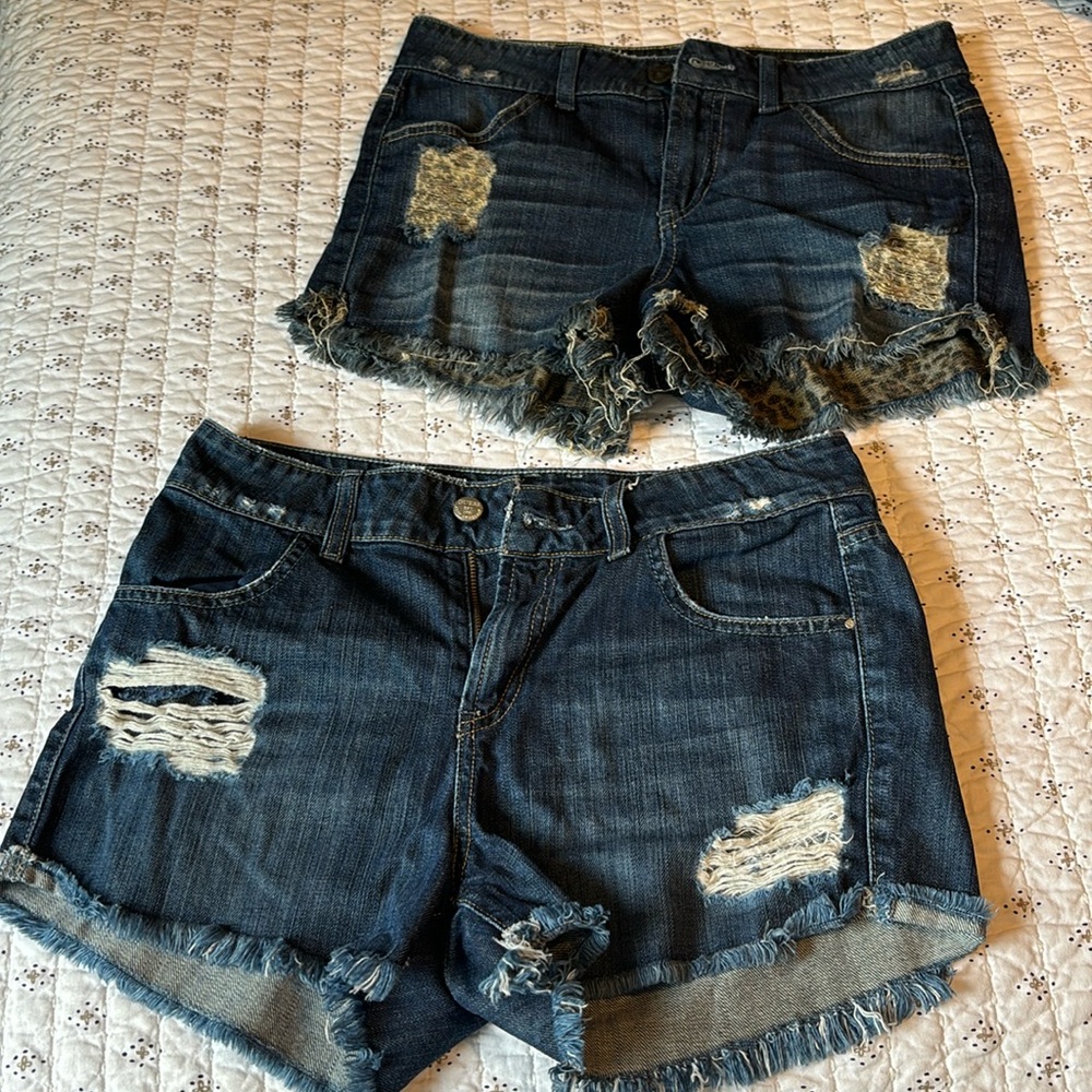 Guess cut off shorts. Size 27. Two pairs with hole details and cut off legs.